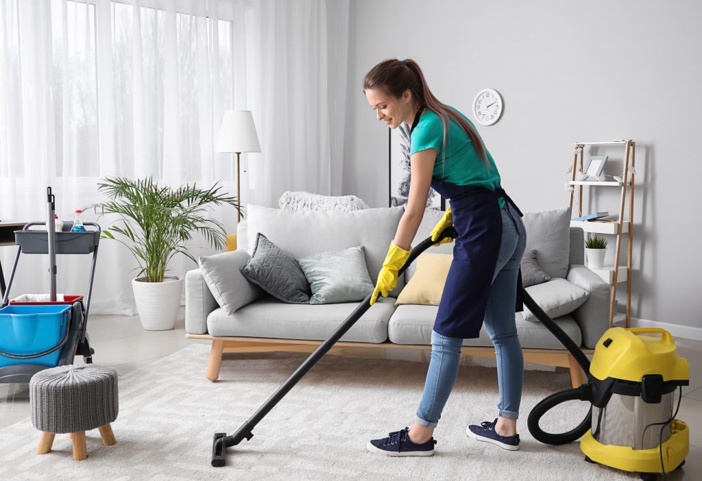 A woman vacuuming